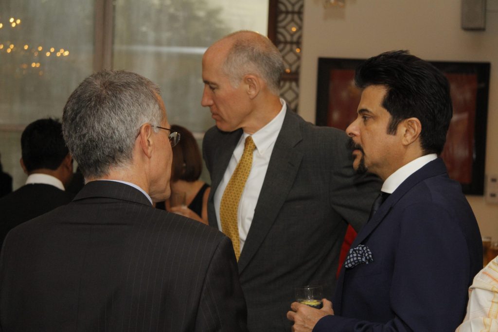 Anil Kapoor in a dark suit among guests at a formal event in 2012