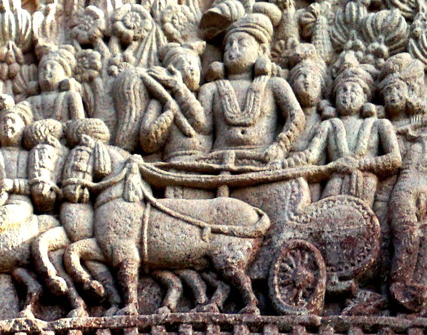Ancient stone relief at Sanchi showing Emperor Ashoka in a chariot with attendants