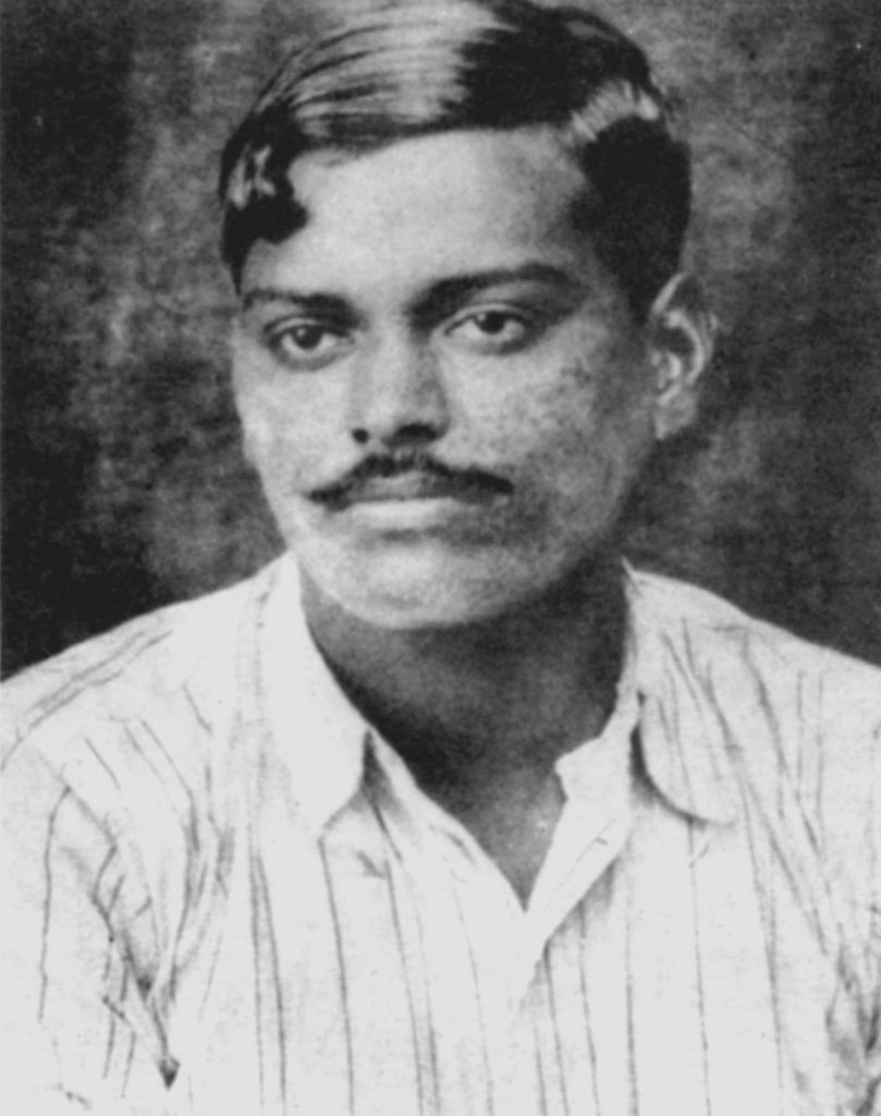 Black and white portrait of Chandrashekhar Azad in a striped shirt