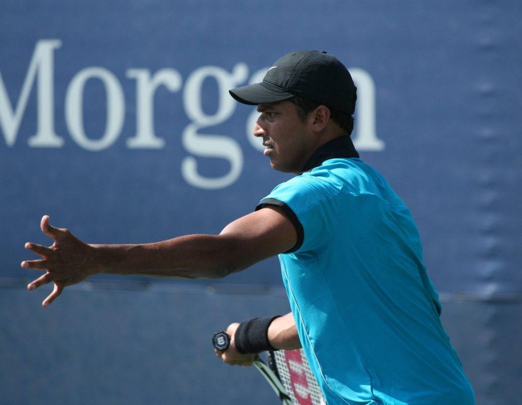 Mahesh Bhupathi in a blue shirt and cap at the 2009 US Open