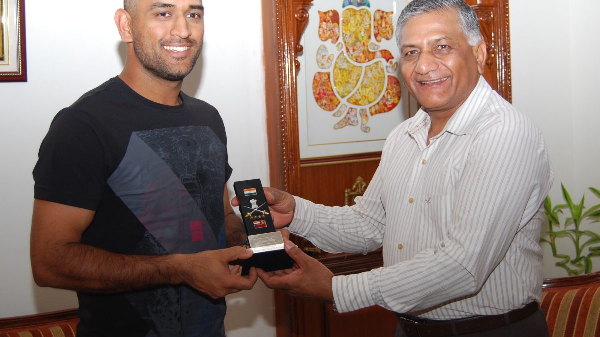 MS Dhoni receiving a memento from Army Chief General V.K. Singh in New Delhi, 2011