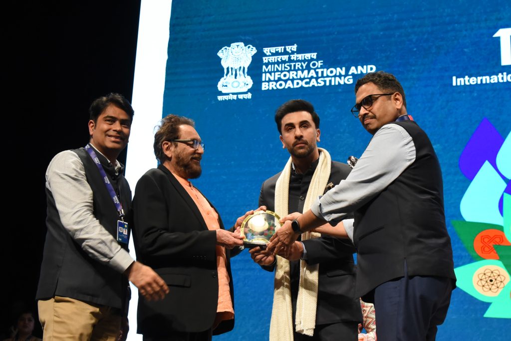 Ranbir Kapoor being felicitated by officials on stage at the International Film Festival of India in Goa