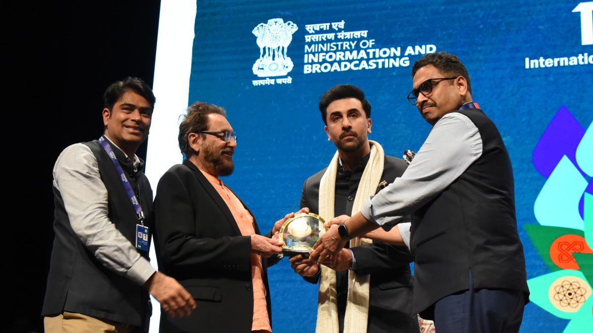 Ranbir Kapoor being felicitated by officials on stage at the International Film Festival of India in Goa