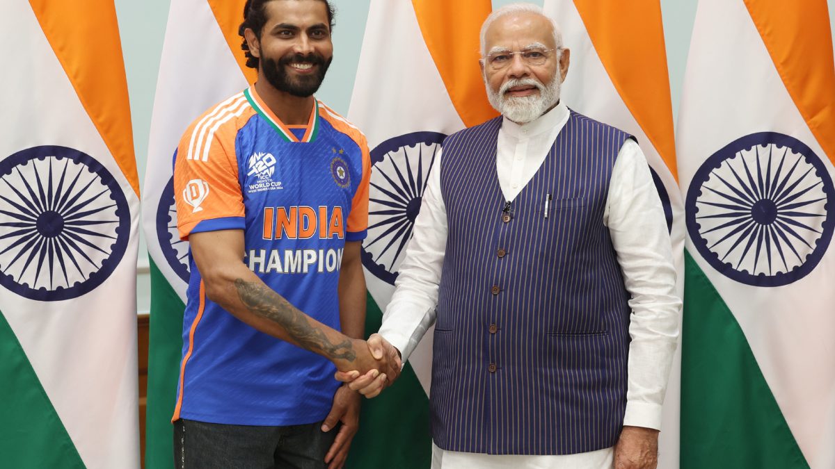 Ravindra Jadeja in an India Champions jersey shaking hands with Prime Minister Narendra Modi