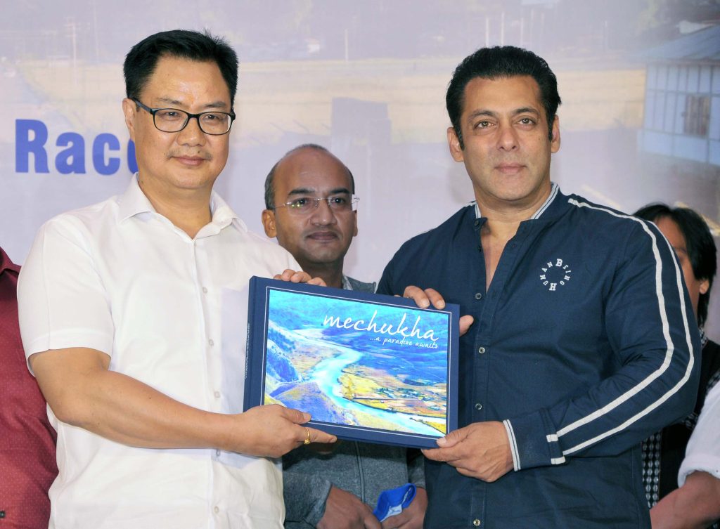 Union Minister Kiren Rijiju presenting a coffee table book to Salman Khan at a press event in Mumbai