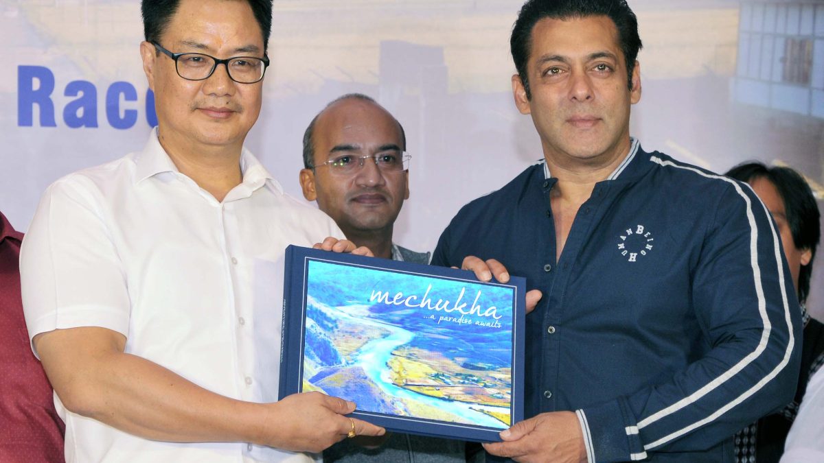 Union Minister Kiren Rijiju presenting a coffee table book to Salman Khan at a press event in Mumbai