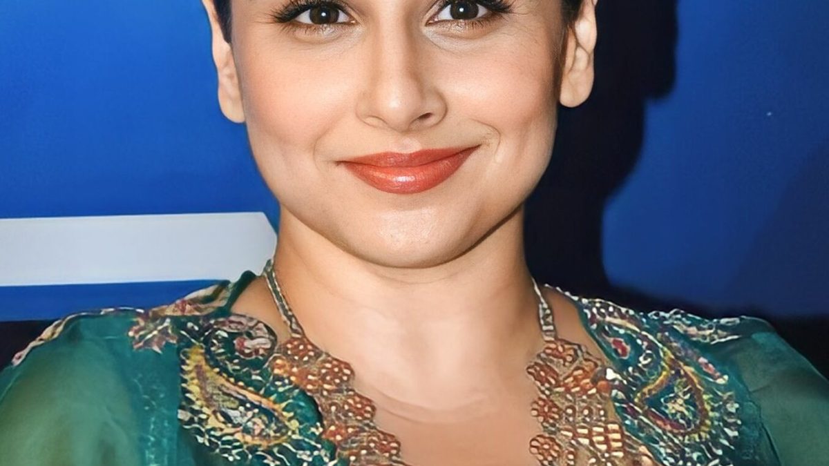 Vidya Balan smiling with her hair tied back at the Dadasaheb Phalke International Film Festival Awards