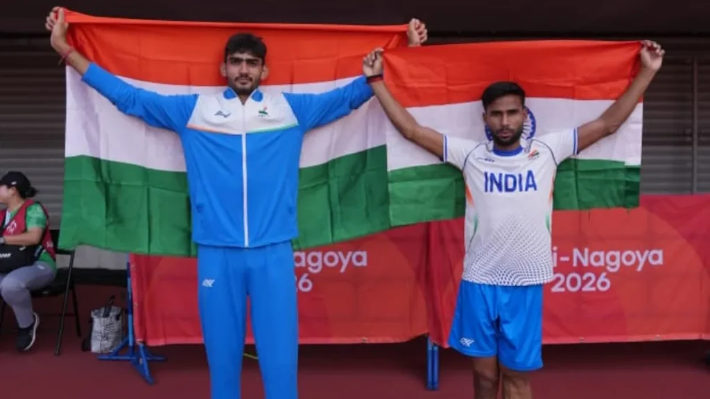 Praveen Kumar and Banti holding the Indian flag at the Asian Para Games in Aichi-Nagoya