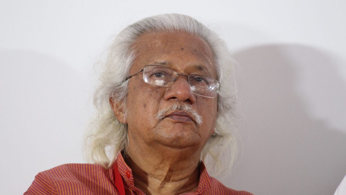 Close-up of Adoor Gopalakrishnan with white hair and glasses