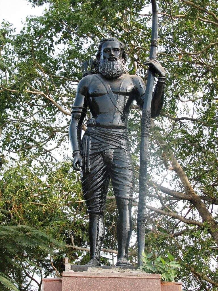 A bronze statue of Alluri Sitarama Raju holding a bow