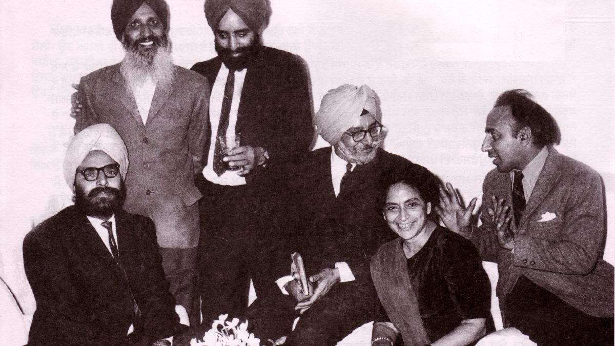 A black-and-white group photograph of Amrita Pritam seated among five Punjabi writers