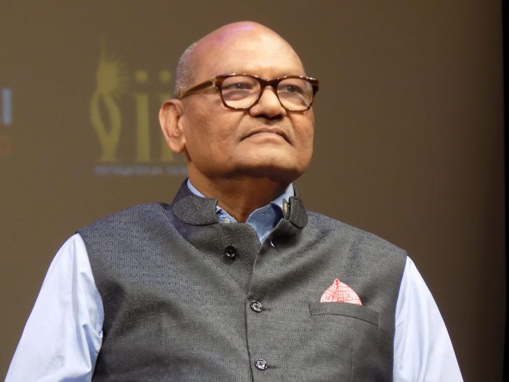 Close-up of Anil Agarwal in glasses and a dark waistcoat, smiling