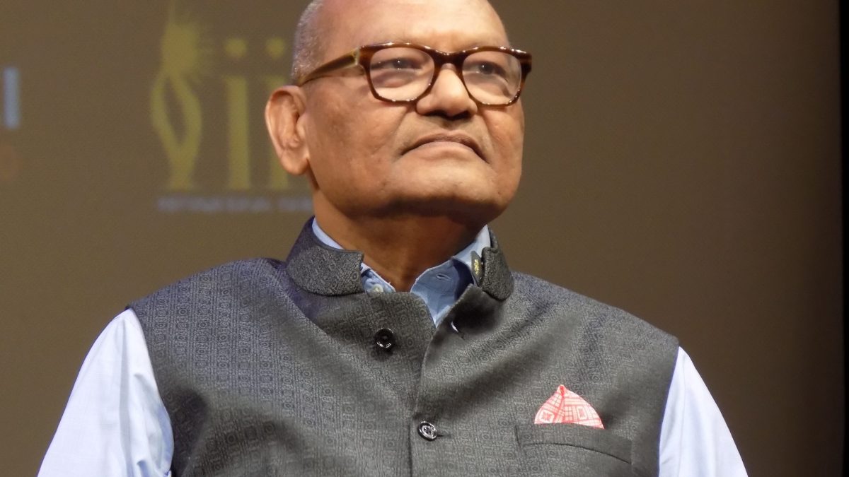 Close-up of Anil Agarwal in glasses and a dark waistcoat, smiling