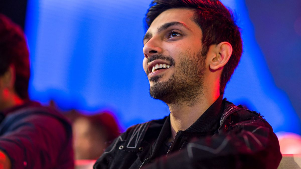 Anirudh Ravichander smiling in a black jacket at a film music launch