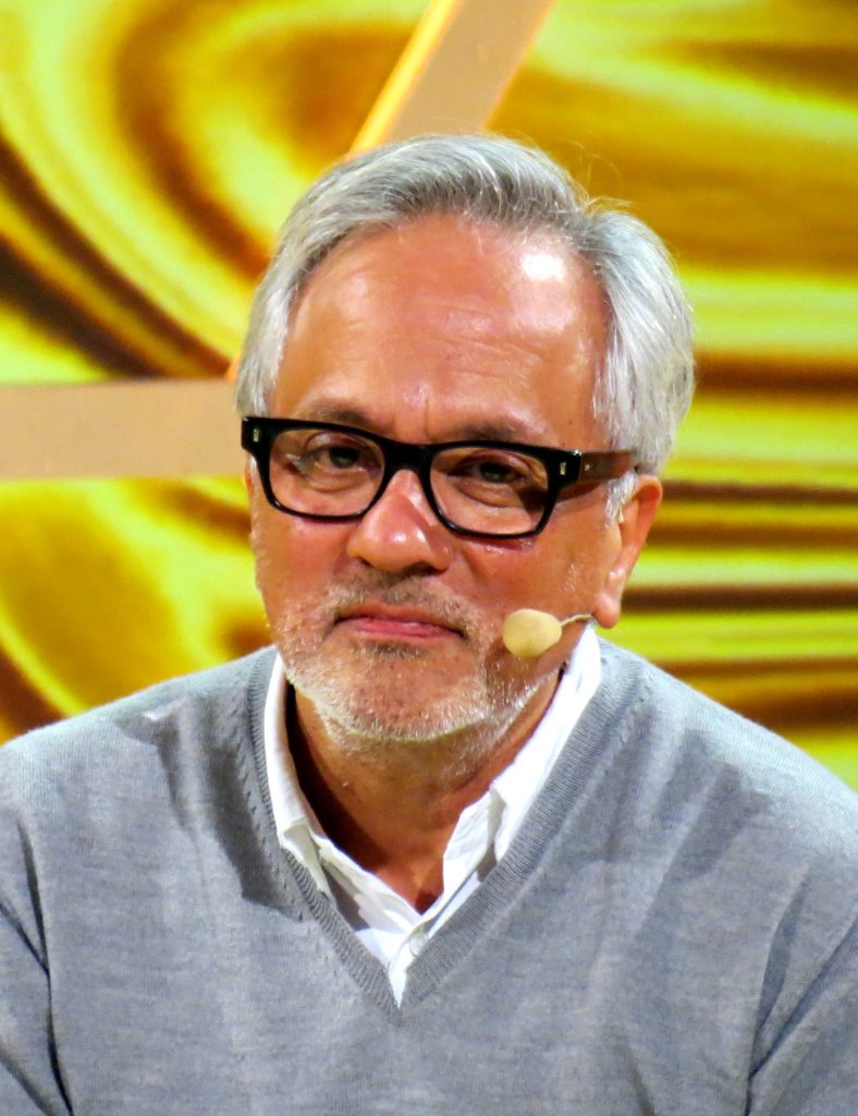 Anish Kapoor in glasses and a dark jacket during an interview