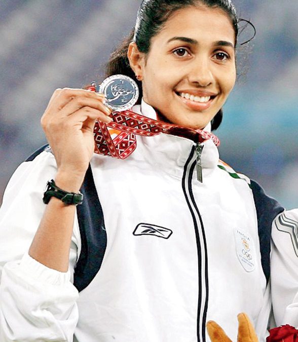Anju Bobby George in an India vest at an athletics stadium