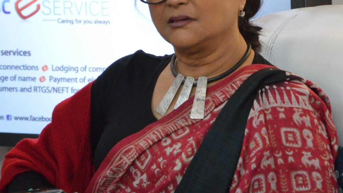 Aparna Sen in glasses and a sari, smiling