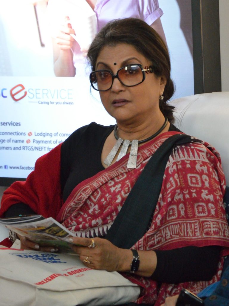 Aparna Sen in glasses and a sari, smiling