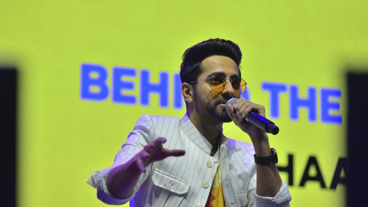 Ayushmann Khurrana singing into a microphone on stage at IFP Season 8 in Mumbai