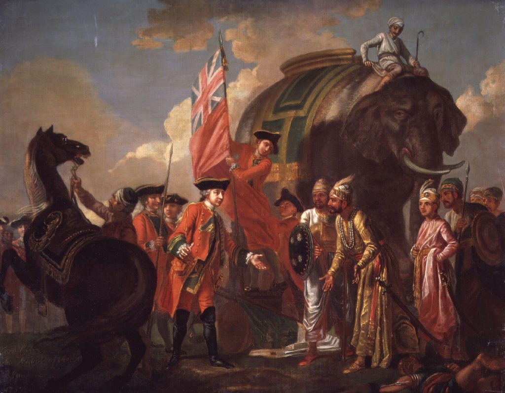 An oil painting of Robert Clive in a red coat greeting Mir Jafar and his attendants beside an elephant after the Battle of Plassey