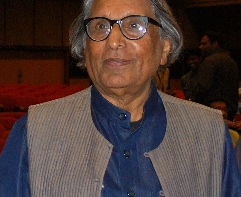 B. V. Doshi in glasses and a grey waistcoat
