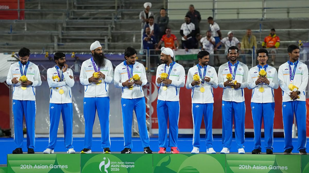Indian men's hockey team members with gold medals on the podium at the 20th Asian Games in Aichi-Nagoya