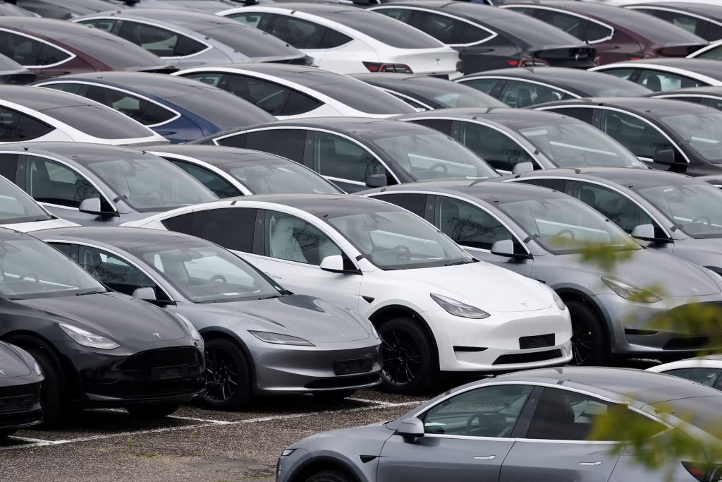 Rows of electric cars parked closely together in a lot