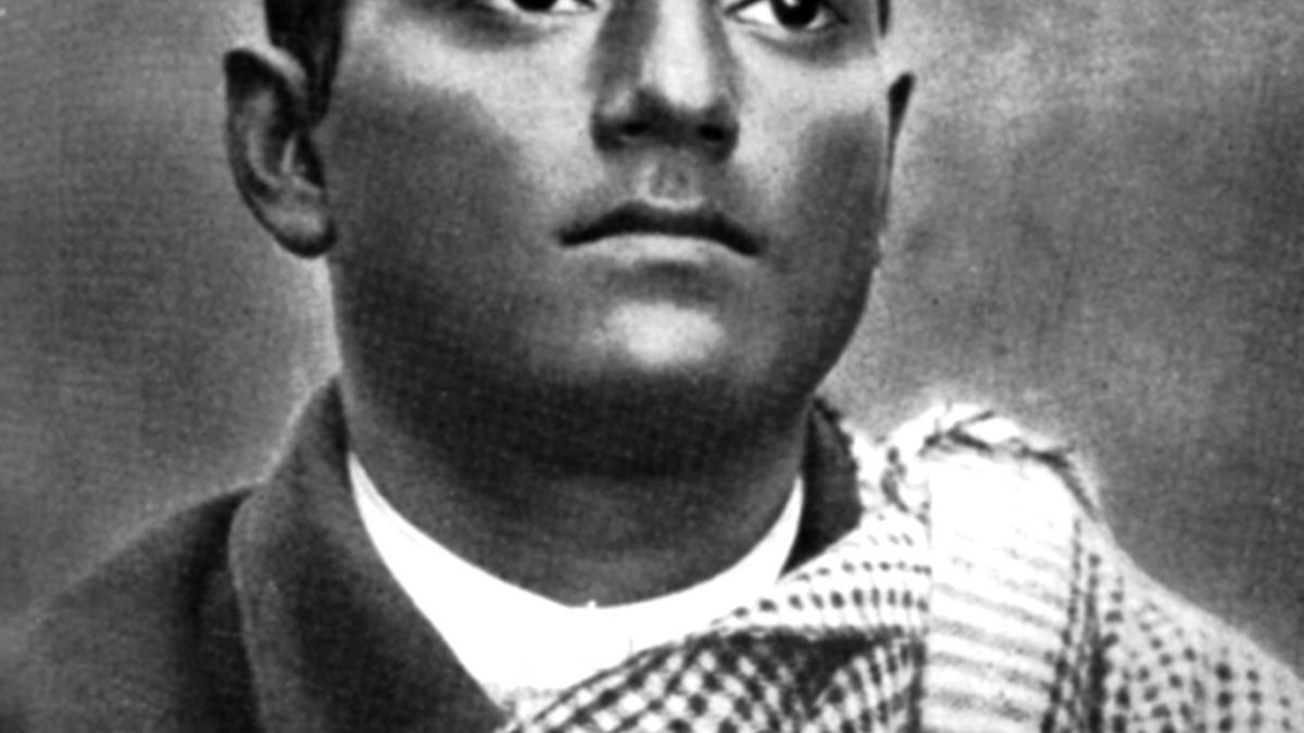 Black-and-white portrait of Bagha Jatin as a young man with a checked shawl over his shoulder