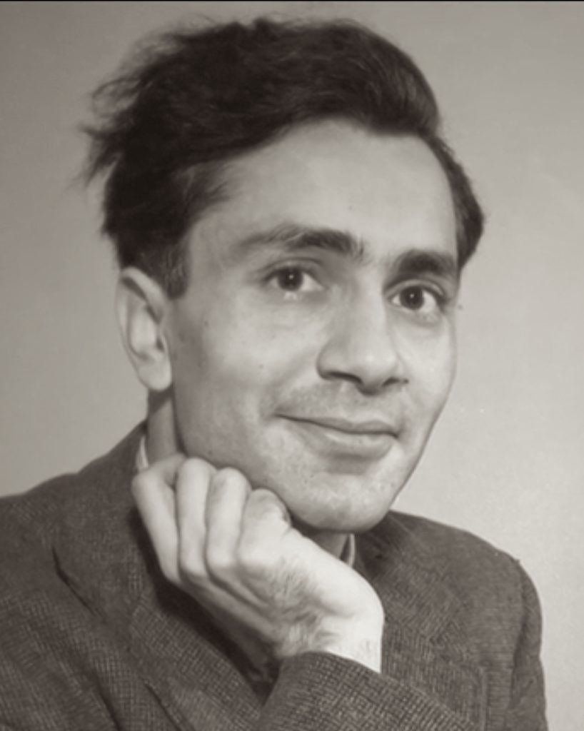A black-and-white portrait of the young Balraj Sahni resting his chin on his hand