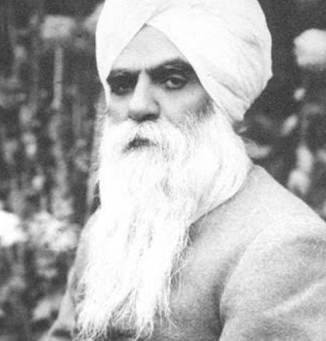 A black-and-white portrait of Bhai Vir Singh in a white turban with a long white beard