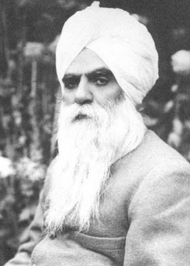A black-and-white portrait of Bhai Vir Singh in a white turban with a long white beard