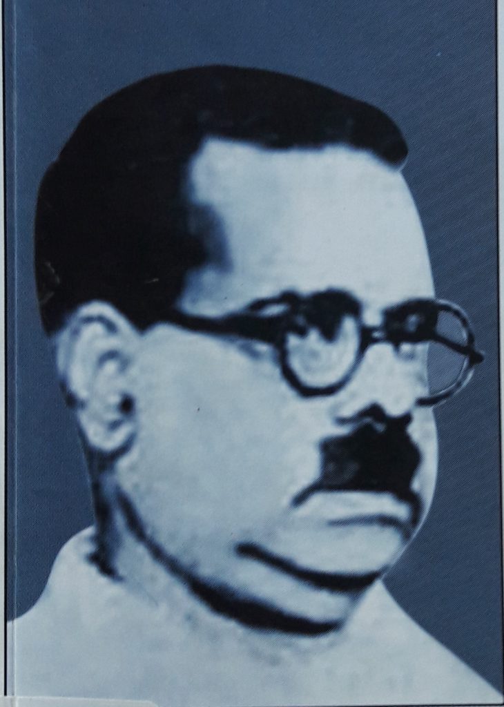 Black-and-white portrait of Bharathidasan with round glasses and a moustache