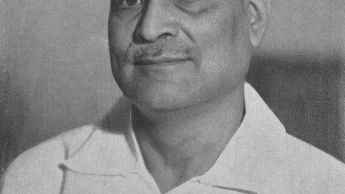 Black-and-white portrait of Bidhan Chandra Roy in a white open-collared shirt