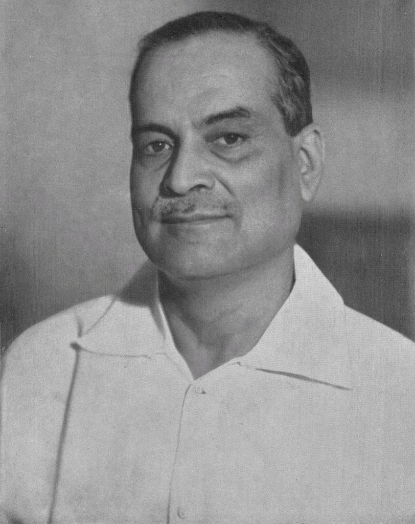 Black-and-white portrait of Bidhan Chandra Roy in a white open-collared shirt