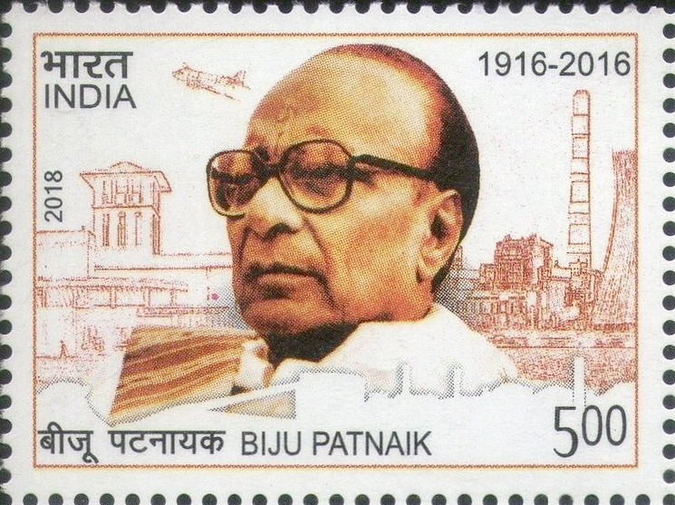 An Indian postage stamp with a portrait of Biju Patnaik and an aircraft