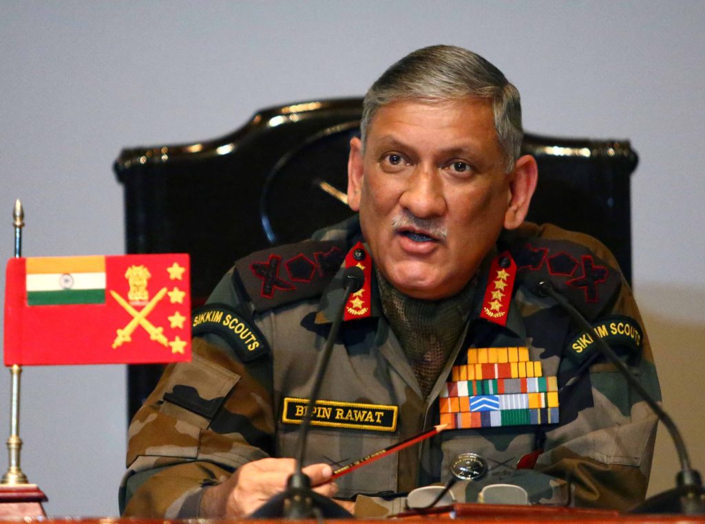 General Bipin Rawat in army uniform with medals speaking at a press conference