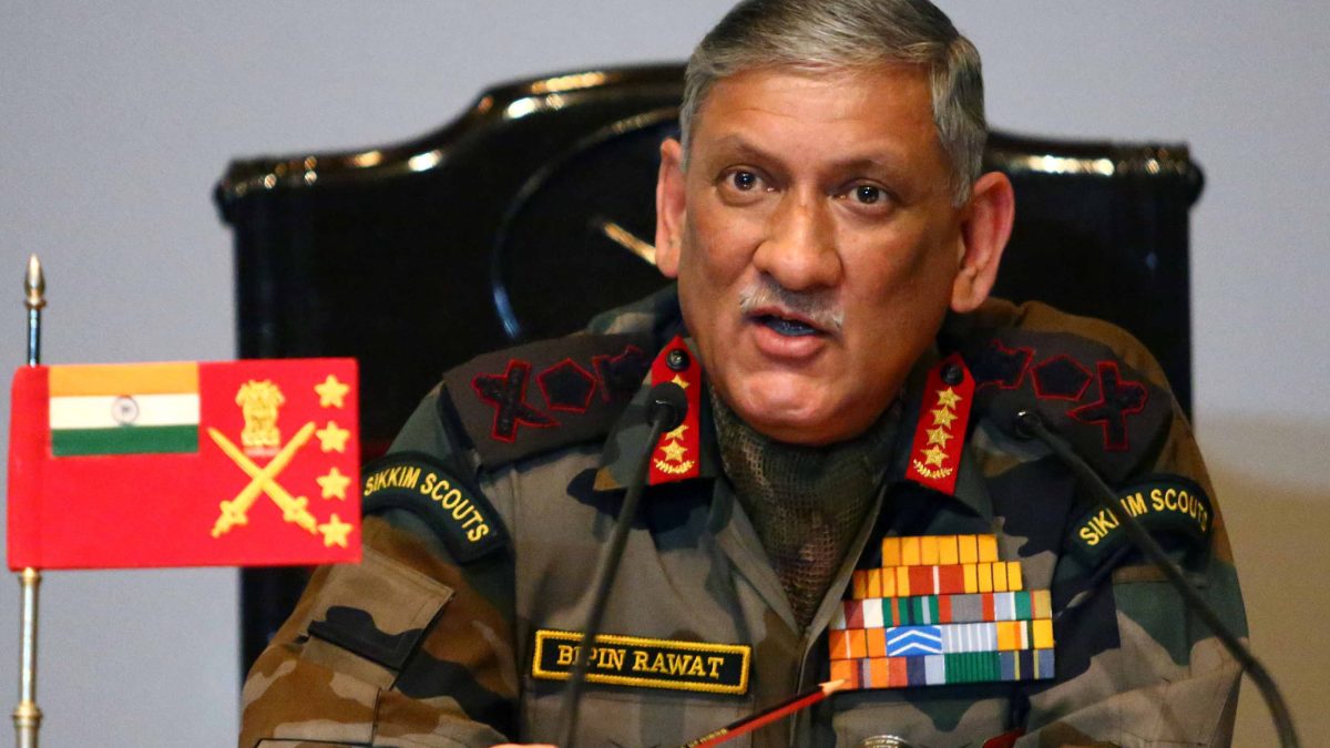 General Bipin Rawat in army uniform with medals speaking at a press conference