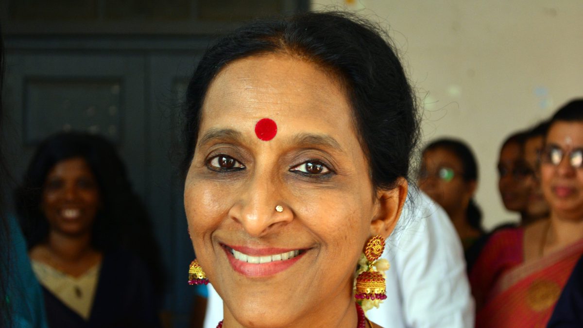 Close-up of Bombay Jayashri smiling, wearing a red bindi