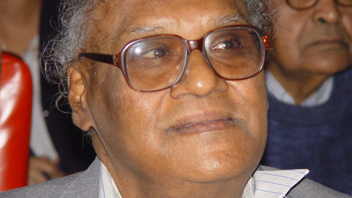 C. N. R. Rao in glasses and a grey jacket, smiling