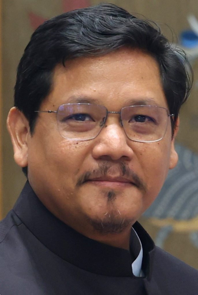 Conrad Sangma in glasses and a dark bandhgala jacket