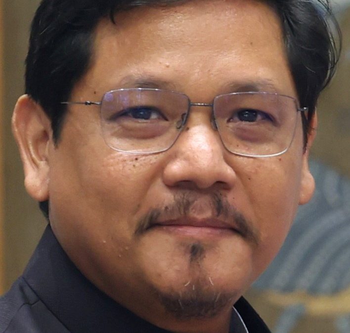 Conrad Sangma in glasses and a dark bandhgala jacket