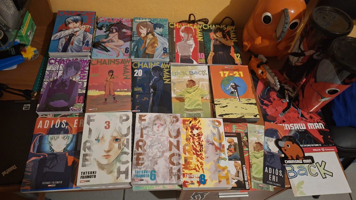 A collection of manga volumes laid out on a floor