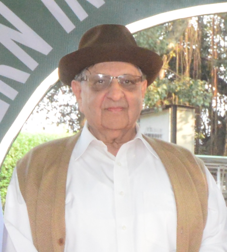 Cyrus Poonawalla in a hat, glasses and a waistcoat