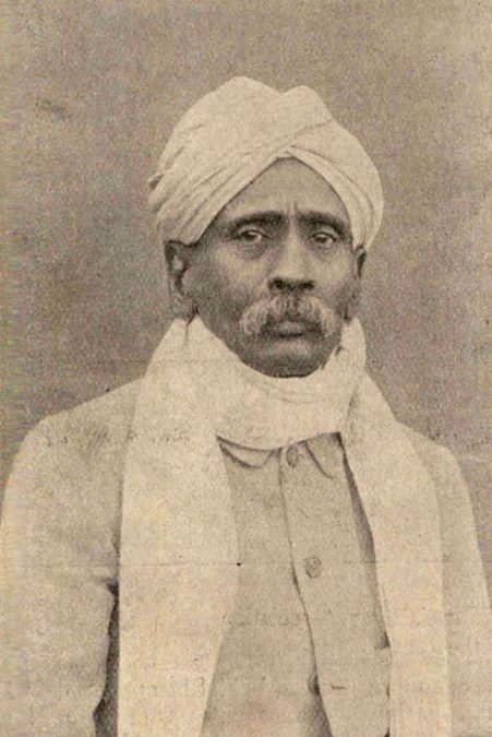 An old photograph of Dhondo Keshav Karve in a turban and shawl