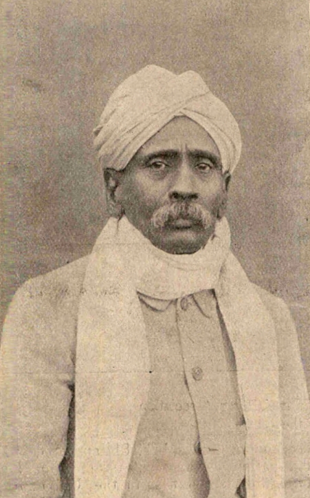 An old photograph of Dhondo Keshav Karve in a turban and shawl