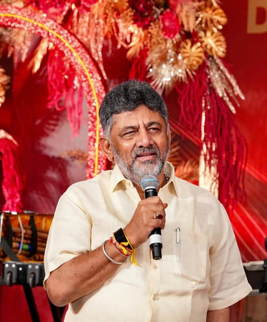D. K. Shivakumar speaking into a microphone