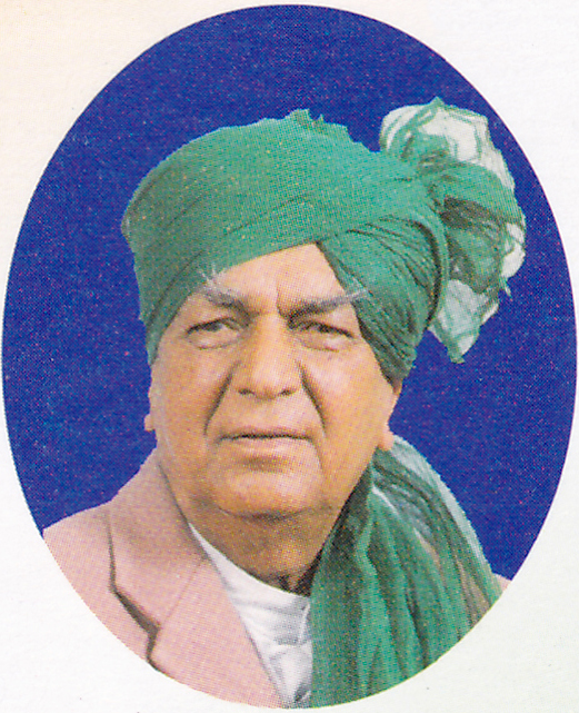 A portrait of Devi Lal in a green turban, from a postage stamp
