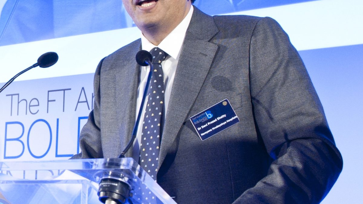Devi Shetty in a suit at an awards event