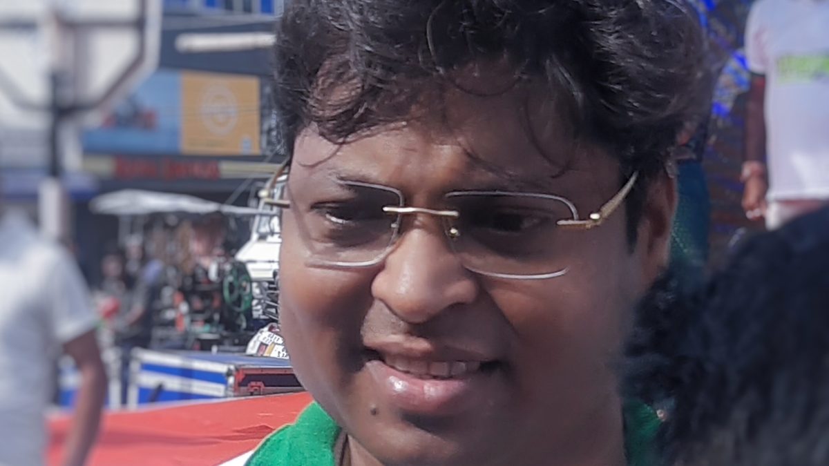 Dilip Tirkey in glasses, smiling