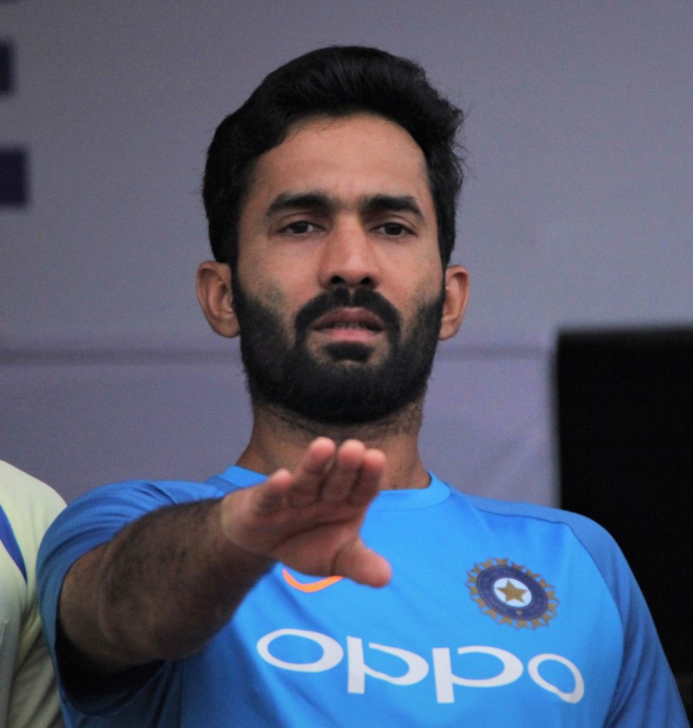Dinesh Karthik with a beard in a blue India training jersey